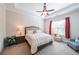 Inviting main bedroom with a large bed, soft lighting, and a ceiling fan at 307 Serenity Way, Woodstock, GA 30188