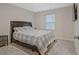 Cozy bedroom featuring a queen-size bed with a patterned blanket and a flat screen TV at 370 Cassidy Trl, Douglasville, GA 30134