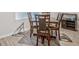 Dining room area with neutral paint and wood flooring, featuring seating for four at 370 Cassidy Trl, Douglasville, GA 30134