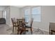 Dining room area with natural lighting, neutral paint, and wooden dining table set at 370 Cassidy Trl, Douglasville, GA 30134