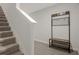 Close up of entryway with staircase and a hall tree with hooks and a bench for storage at 370 Cassidy Trl, Douglasville, GA 30134