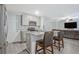 Kitchen featuring gray cabinets, stainless appliances, and granite countertops with breakfast bar at 370 Cassidy Trl, Douglasville, GA 30134