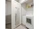 Efficient laundry area showcases a washer, dryer, and organized shelving for storage at 370 Cassidy Trl, Douglasville, GA 30134