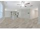Open concept kitchen and living area featuring gray flooring, neutral paint, and stainless appliances at 370 Cassidy Trl, Douglasville, GA 30134