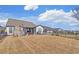 Beautiful backyard features a stone fireplace, patio and fenced in yard at 5719 Sierra Bend Way, Hoschton, GA 30548