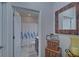 Bathroom featuring a shower curtain and stacked antique suitcases at 5719 Sierra Bend Way, Hoschton, GA 30548