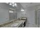 Bathroom featuring granite countertops, double sinks and glass shower at 5719 Sierra Bend Way, Hoschton, GA 30548