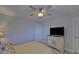 Bedroom includes a ceiling fan and a TV on a decorative cabinet at 5719 Sierra Bend Way, Hoschton, GA 30548