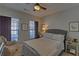 Cozy bedroom with natural light and ceiling fan at 5719 Sierra Bend Way, Hoschton, GA 30548