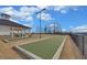 Community bocce ball courts for residents' enjoyment with shaded picnic tables nearby at 5719 Sierra Bend Way, Hoschton, GA 30548