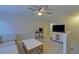 Cozy bonus room features a ceiling fan and a comfortable seating area at 5719 Sierra Bend Way, Hoschton, GA 30548