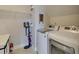 Bright laundry room features modern washer and dryer at 5719 Sierra Bend Way, Hoschton, GA 30548
