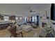 Open-concept living space flows from the kitchen to living room with a fireplace at 5719 Sierra Bend Way, Hoschton, GA 30548