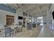 A comfortable lounge area with a fireplace, bookshelves, and plenty of seating perfect for relaxing and socializing at 5719 Sierra Bend Way, Hoschton, GA 30548