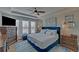 Main bedroom with tray ceiling, a large bed, a ceiling fan, and a flat screen tv at 5719 Sierra Bend Way, Hoschton, GA 30548