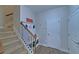 Mud room featuring coat hooks, built-in storage and stairway access at 5719 Sierra Bend Way, Hoschton, GA 30548