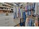 Spacious walk-in closet with custom shelving and ample storage space at 5719 Sierra Bend Way, Hoschton, GA 30548