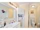 Well-lit bathroom with a vanity, updated fixtures, and plenty of storage space at 740 Helga Ne Dr, Woodstock, GA 30188