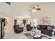 Welcoming living room with a white fireplace, brown leather furniture, and open floorplan at 740 Helga Ne Dr, Woodstock, GA 30188