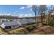 Aerial view of a neighborhood with well-maintained yards and homes featuring screened porches and lush landscaping at 213 Saratoga Dr, Acworth, GA 30102