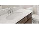 Elegant bathroom vanity with marble countertop, chrome faucet, and warm wood accents at 213 Saratoga Dr, Acworth, GA 30102