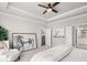 Spacious bedroom features a tray ceiling and stylish decor with ensuite bathroom at 213 Saratoga Dr, Acworth, GA 30102