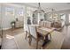 Bright dining room features hardwood floors, elegant light fixture and natural light at 213 Saratoga Dr, Acworth, GA 30102