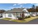 Bright home with white siding, columned front porch, and lush lawn, presenting a welcoming and polished curb appeal at 213 Saratoga Dr, Acworth, GA 30102