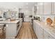 Modern kitchen with stainless steel appliances, granite countertops, and wooden floors at 213 Saratoga Dr, Acworth, GA 30102