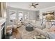 Inviting living room with lots of natural light, neutral décor, and wood floors at 213 Saratoga Dr, Acworth, GA 30102