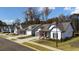 Street view of beautifully designed homes featuring craftsman-style details and well-kept lawns at 213 Saratoga Dr, Acworth, GA 30102