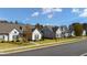 Street view of homes with manicured lawns and tasteful landscaping adding curb appeal to the neighborhood at 213 Saratoga Dr, Acworth, GA 30102