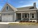 Charming single-Gathering home with a two-car garage, covered porch, and neutral gray siding and roof at 241 Saratoga Dr, Acworth, GA 30102