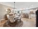 Bright dining area with hardwood floors, stylish furnishings, and an open floor plan at 2975 Thistle Trl, Suwanee, GA 30024