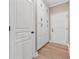 Hallway features wood floor and white built-in cabinets and doors at 2975 Thistle Trl, Suwanee, GA 30024