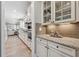 Elegant kitchen featuring white cabinets, granite countertops, and modern appliances at 2975 Thistle Trl, Suwanee, GA 30024