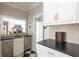 Bar area with a granite countertop, stainless steel appliances, and a view into the living area at 3565 Haddon Hall Nw Rd, Atlanta, GA 30327