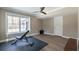 Basement area with work out equipment and large window at 3565 Haddon Hall Nw Rd, Atlanta, GA 30327