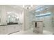 Elegant primary bathroom featuring dual vanities, white cabinets, and a luxurious shower with multiple shower heads at 3565 Haddon Hall Nw Rd, Atlanta, GA 30327