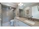 Bathroom with double sink vanity and glass enclosed shower at 3565 Haddon Hall Nw Rd, Atlanta, GA 30327