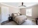 Cozy bedroom with neutral tones, ceiling fan, and natural light at 3565 Haddon Hall Nw Rd, Atlanta, GA 30327