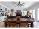 Open-concept living space with built-in bookshelves, fireplace, and a large dining table with seating at 3565 Haddon Hall Nw Rd, Atlanta, GA 30327