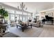 Inviting living room featuring natural light, comfortable seating, and a piano for enjoying music at 3565 Haddon Hall Nw Rd, Atlanta, GA 30327