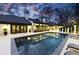 Backyard pool area with lounge chairs at dusk at 3565 Haddon Hall Nw Rd, Atlanta, GA 30327