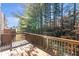 Wooden back deck overlooking mature trees and lush landscaping, offering a private outdoor space at 4000 Howell Park Rd, Duluth, GA 30096