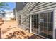 Exterior view of a home featuring a wooden deck with sliding glass doors for easy access at 4000 Howell Park Rd, Duluth, GA 30096