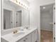 Bathroom featuring double sink vanity and a large mirror at 4000 Howell Park Rd, Duluth, GA 30096