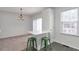 Bright dining area with bar seating and sliding glass doors to the patio at 4000 Howell Park Rd, Duluth, GA 30096