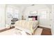 Bedroom featuring light gray walls, two windows, dark hardwood floors, and a plush rug at 57 Rumson Ne Way, Atlanta, GA 30305