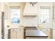 Bright kitchen featuring marble backsplash, countertops, stainless steel appliances, and natural light at 57 Rumson Ne Way, Atlanta, GA 30305